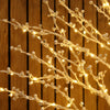 Close-up of the White Berry Twig Tree showing delicate frosted white berries and warm white micro LEDs on slender branches.