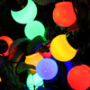 String lights with multicolored bulbs on a dark background